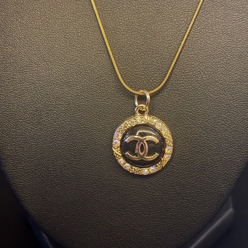 CC Gold and Black Zipper Pull